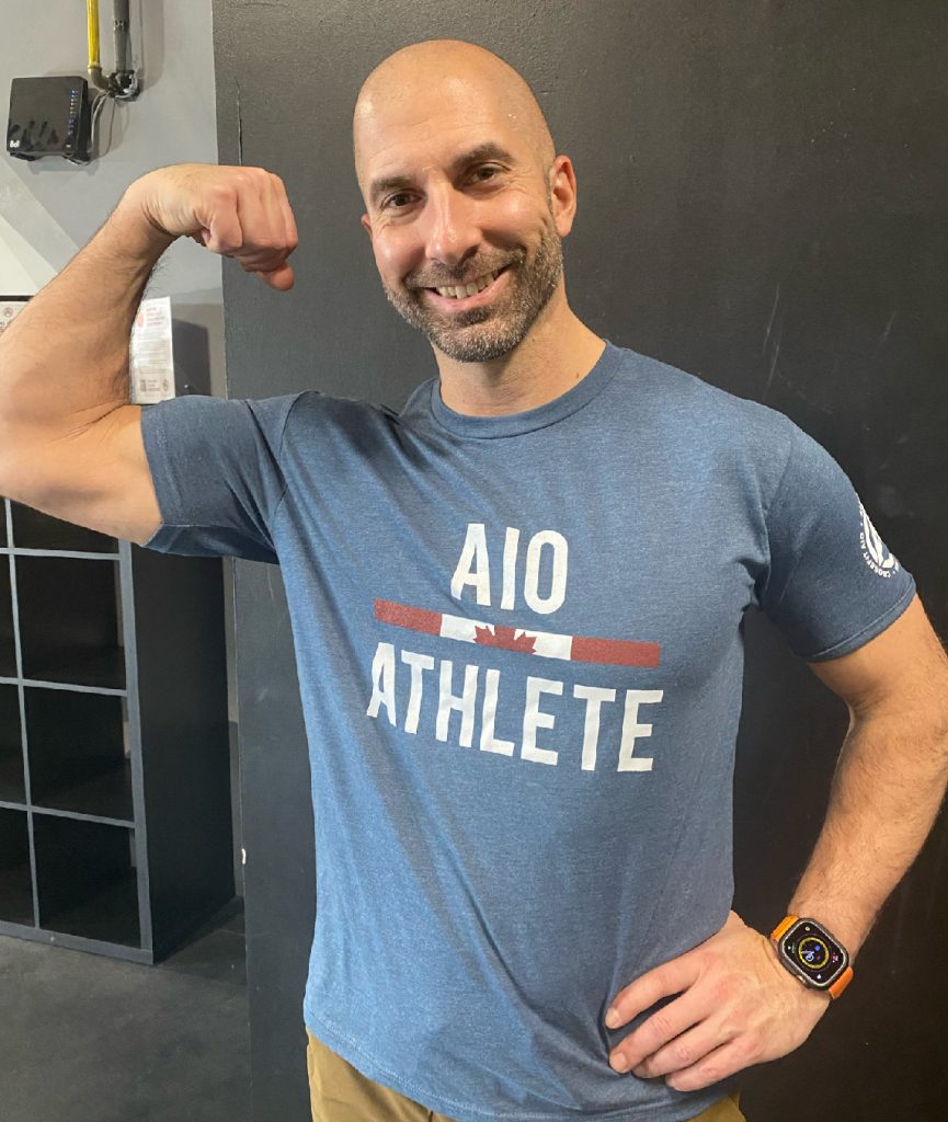 Owner Carlo wearing an AIO shirt