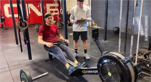 CrossFit AIO member rowing during the CrossFit Open
